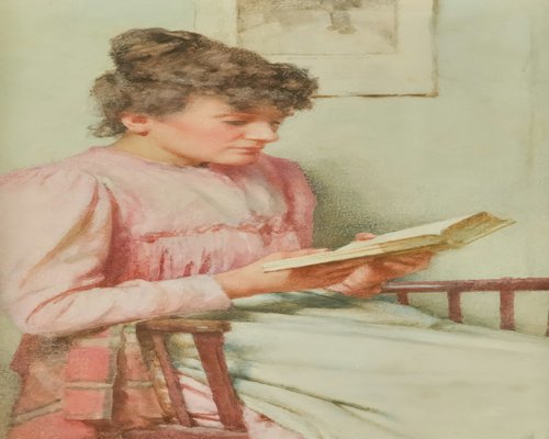 Woman reading a book with soft lighting