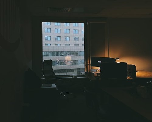 Well-lit workspace with a desk lamp and natural light